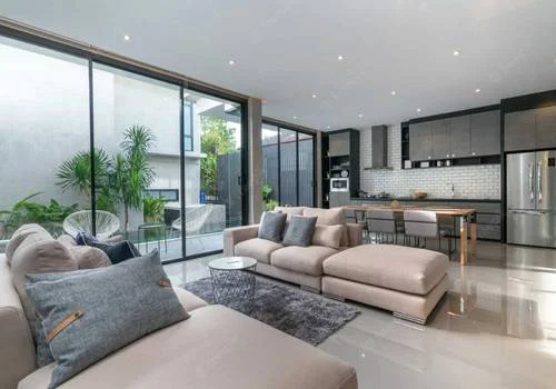 Elegant living room with blue ottoman